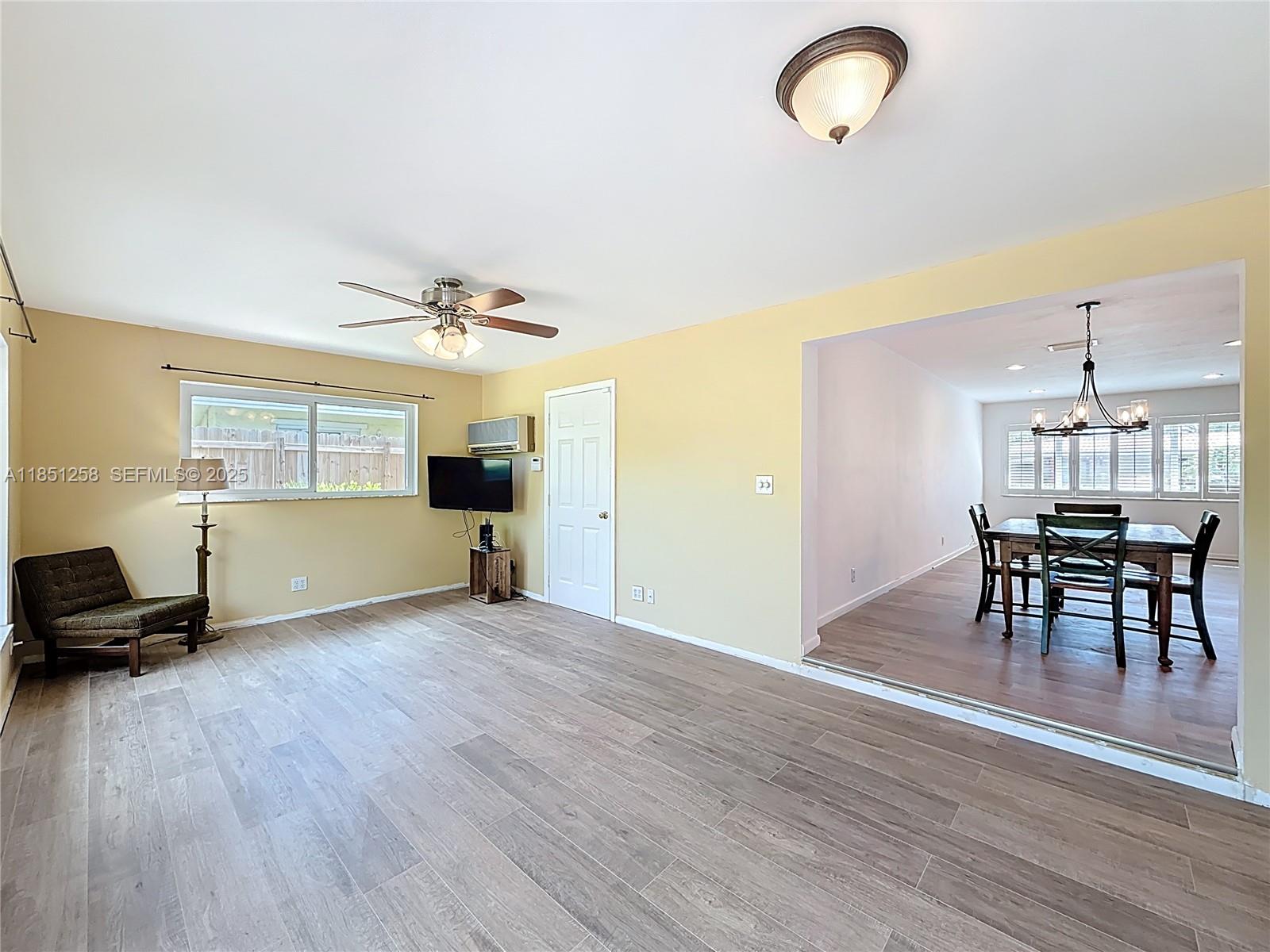 4911 Northeast 24th Avenue Lighthouse Point, FL 33064 - Photo 24 of 63 a view of a room with furniture and wooden floor