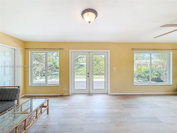 a view of a house with swimming pool and sitting area