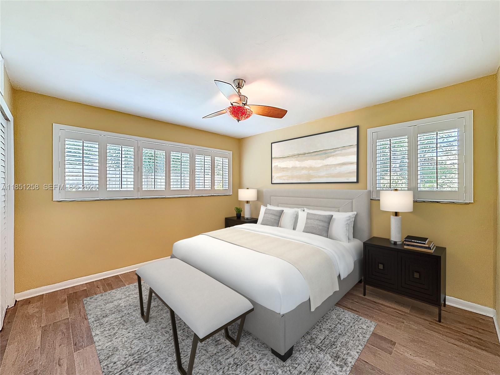 4911 Northeast 24th Avenue Lighthouse Point, FL 33064 - Photo 27 of 63 a living room with a bed furniture and a window