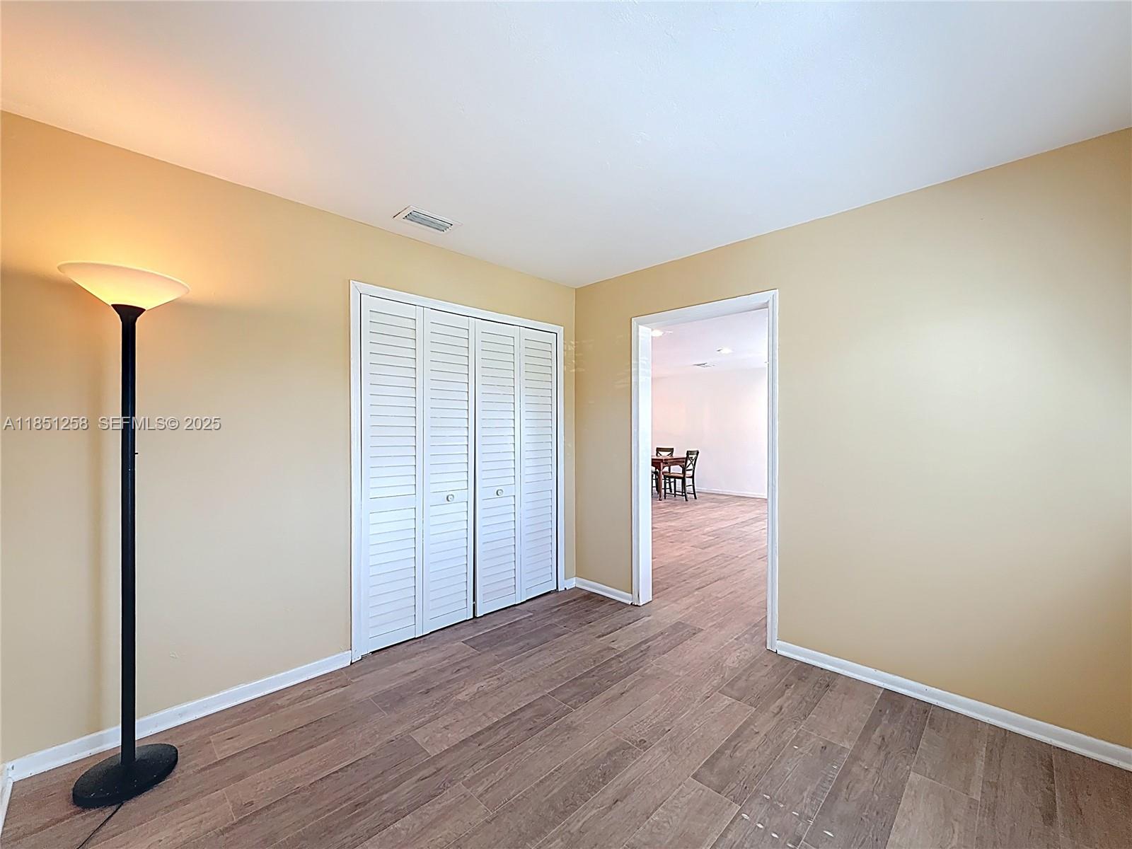 4911 Northeast 24th Avenue Lighthouse Point, FL 33064 - Photo 36 of 63 a view of hallway with wooden floor
