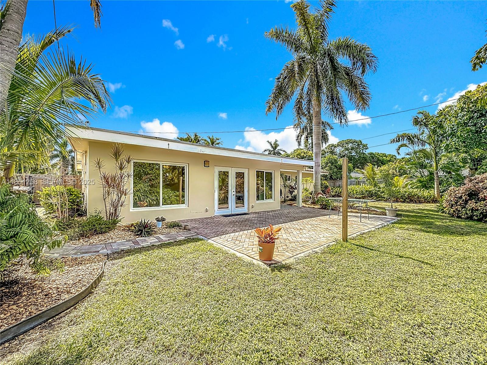 4911 Northeast 24th Avenue Lighthouse Point, FL 33064 - Photo 42 of 63 a view of a house with swimming pool and sitting area