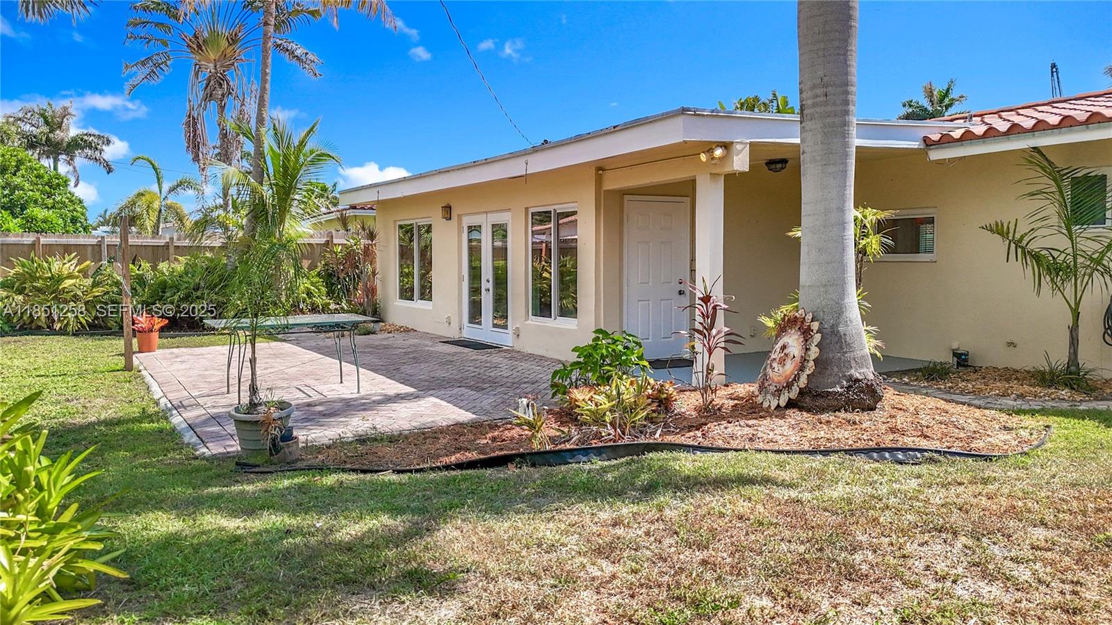 4911 Northeast 24th Avenue Lighthouse Point, FL 33064 - Photo 46 of 63 a view of a house with backyard