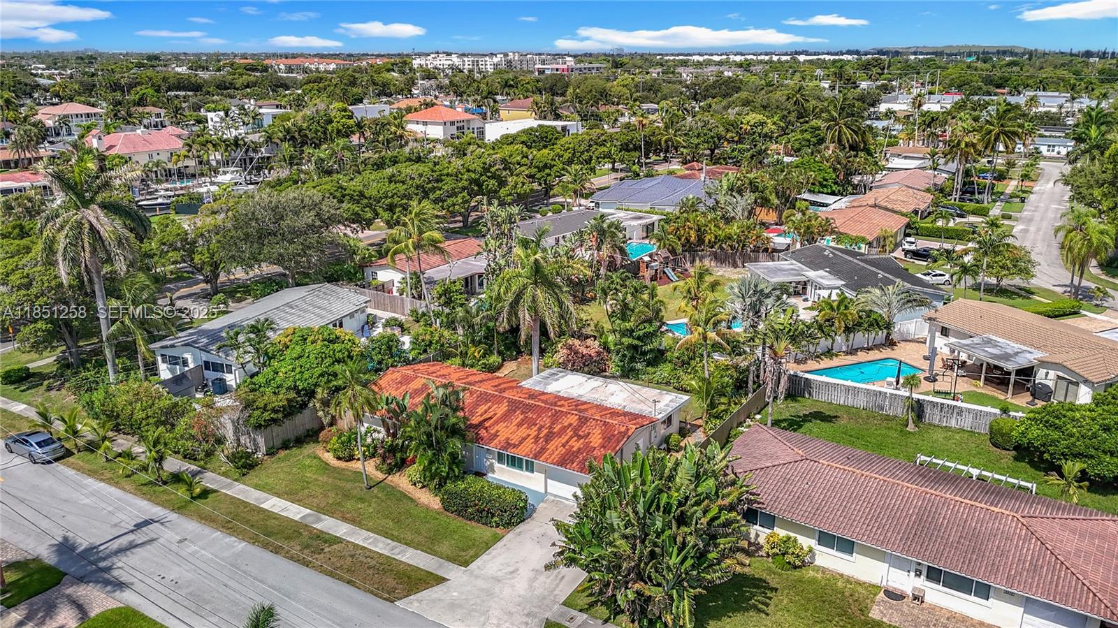 4911 Northeast 24th Avenue Lighthouse Point, FL 33064 - Photo 50 of 63 an aerial view of residential houses with outdoor space and street view