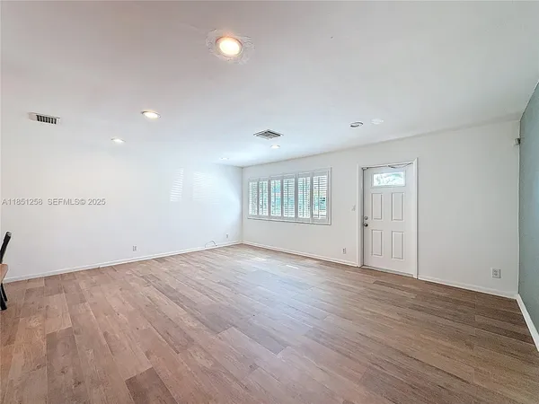 a large kitchen with stainless steel appliances granite countertop a stove and a sink