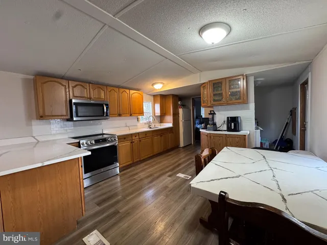a large bed sitting in a bedroom next to a window