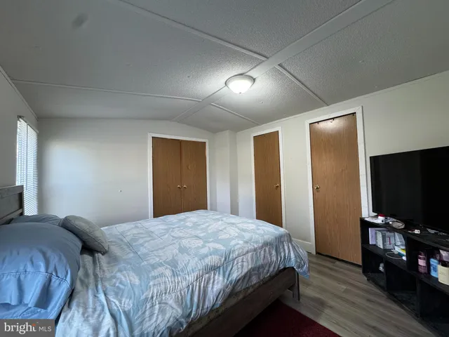 a bathroom with a shower sink and mirror