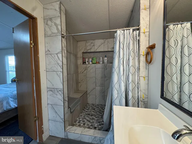 a white toilet sitting next to a bathroom sink