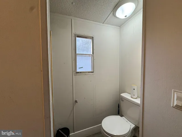 a bedroom with furniture and a wooden floor