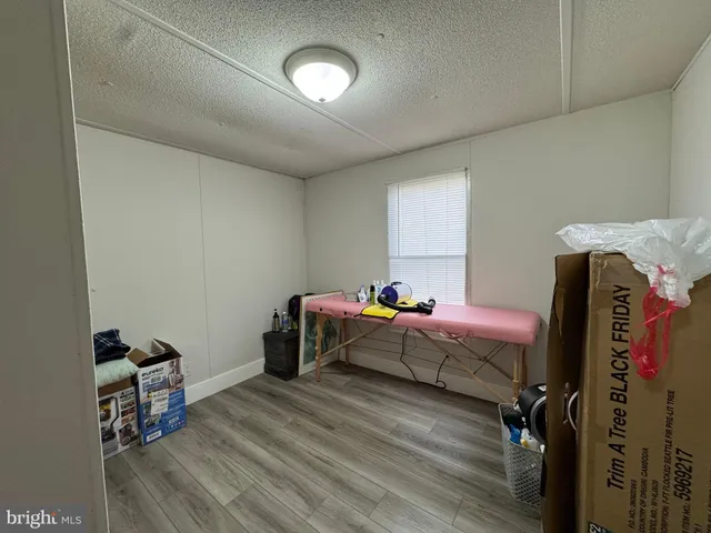 a bedroom with bed and a window