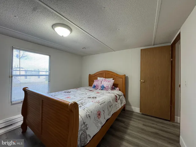 a bedroom with a bed and a lamp