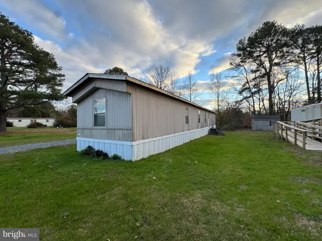 a view of an house with backyard space and garden