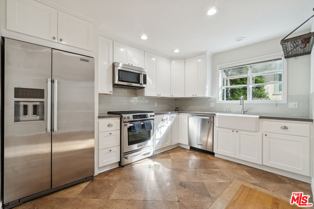 880 Hilldale Avenue, Unit 3 West Hollywood, CA 90069 - Photo 12 of 43 a kitchen with stainless steel appliances a refrigerator sink and microwave