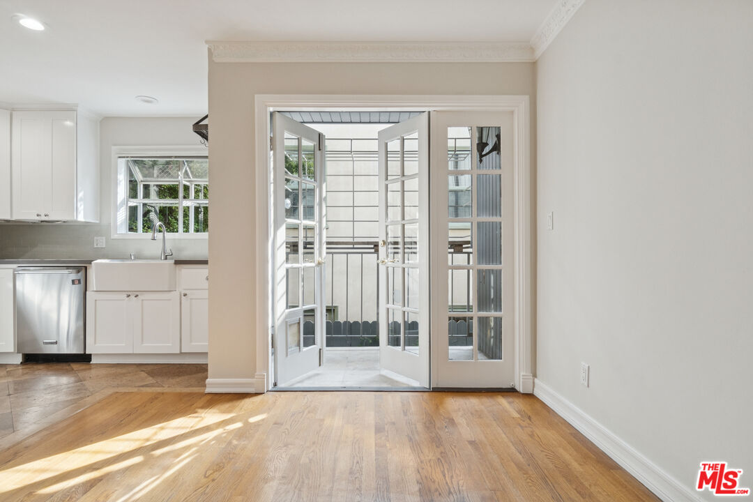 880 Hilldale Avenue, Unit 3 West Hollywood, CA 90069 - Photo 14 of 43 a view of an empty room with a kitchen and a window