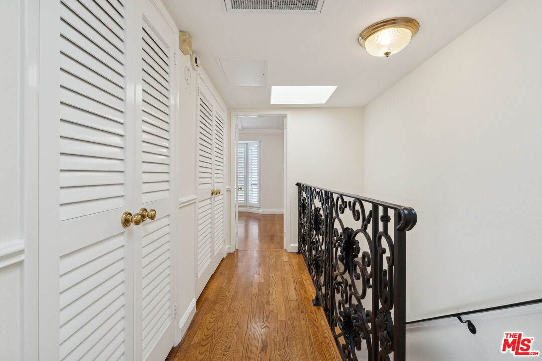 880 Hilldale Avenue, Unit 3 West Hollywood, CA 90069 - Photo 19 of 43 a view of a hallway with wooden floor and staircase