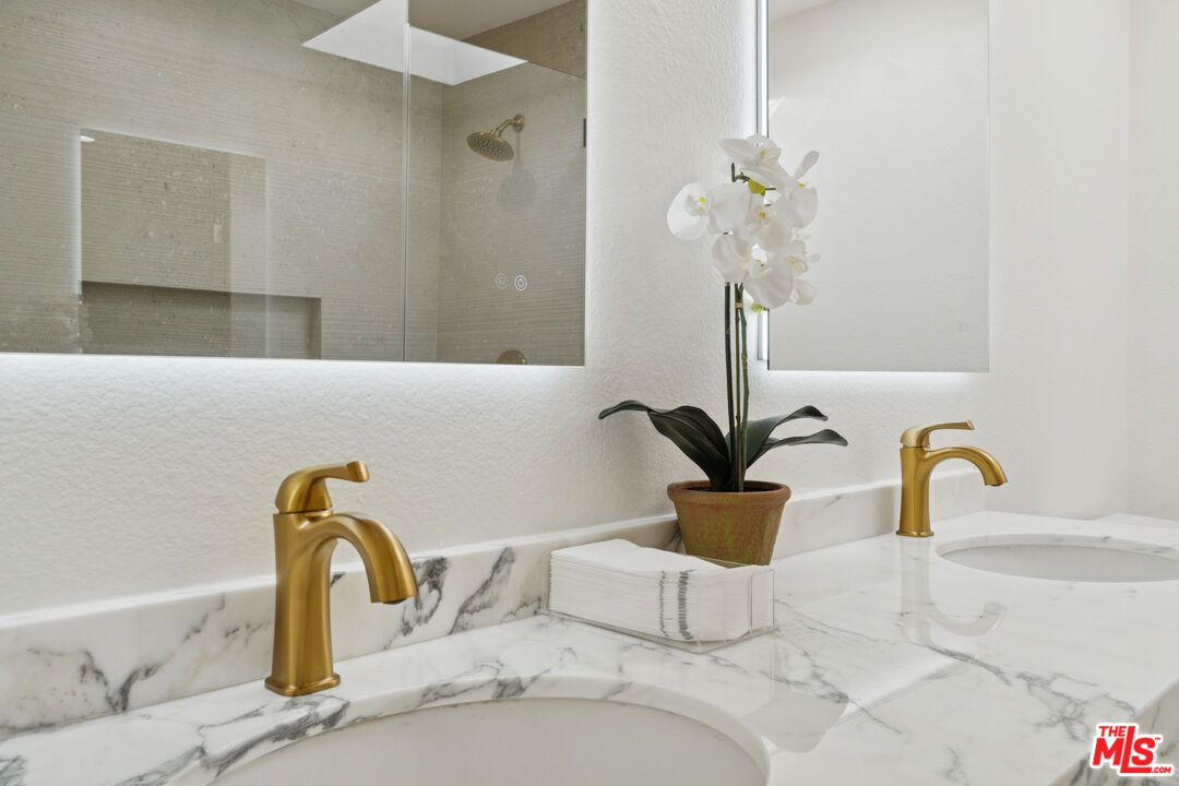 880 Hilldale Avenue, Unit 3 West Hollywood, CA 90069 - Photo 27 of 43 a close view of a faucet a sink and a potted plant