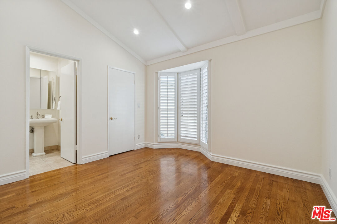 880 Hilldale Avenue, Unit 3 West Hollywood, CA 90069 - Photo 29 of 43 a view of an empty room with wooden floor and a window