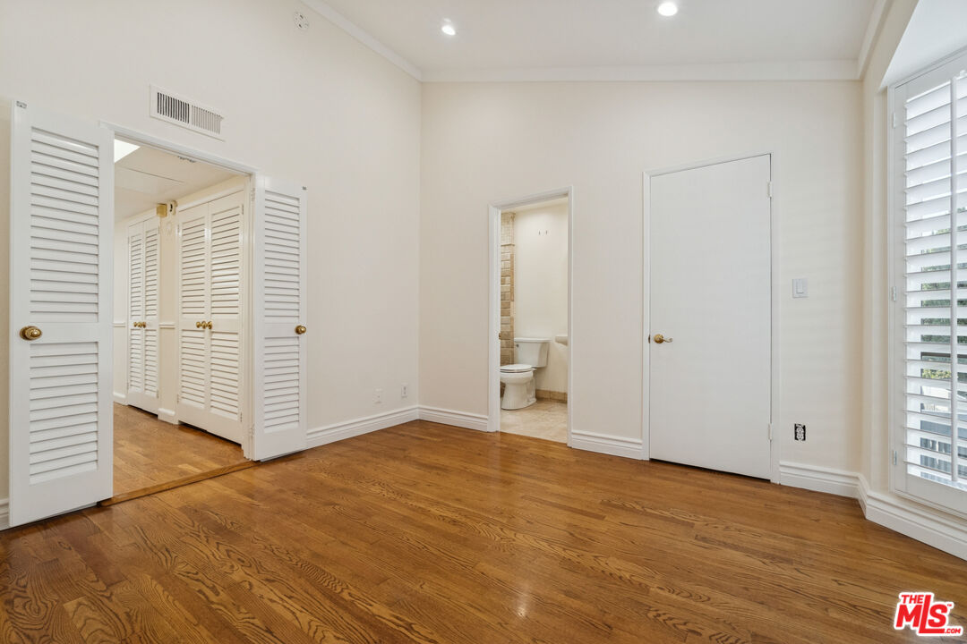 880 Hilldale Avenue, Unit 3 West Hollywood, CA 90069 - Photo 31 of 43 an empty room with wooden floor and windows