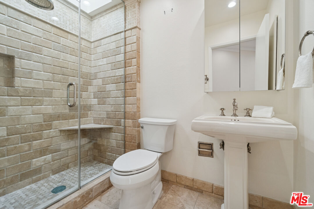 880 Hilldale Avenue, Unit 3 West Hollywood, CA 90069 - Photo 33 of 43 a bathroom with a sink a toilet and shower