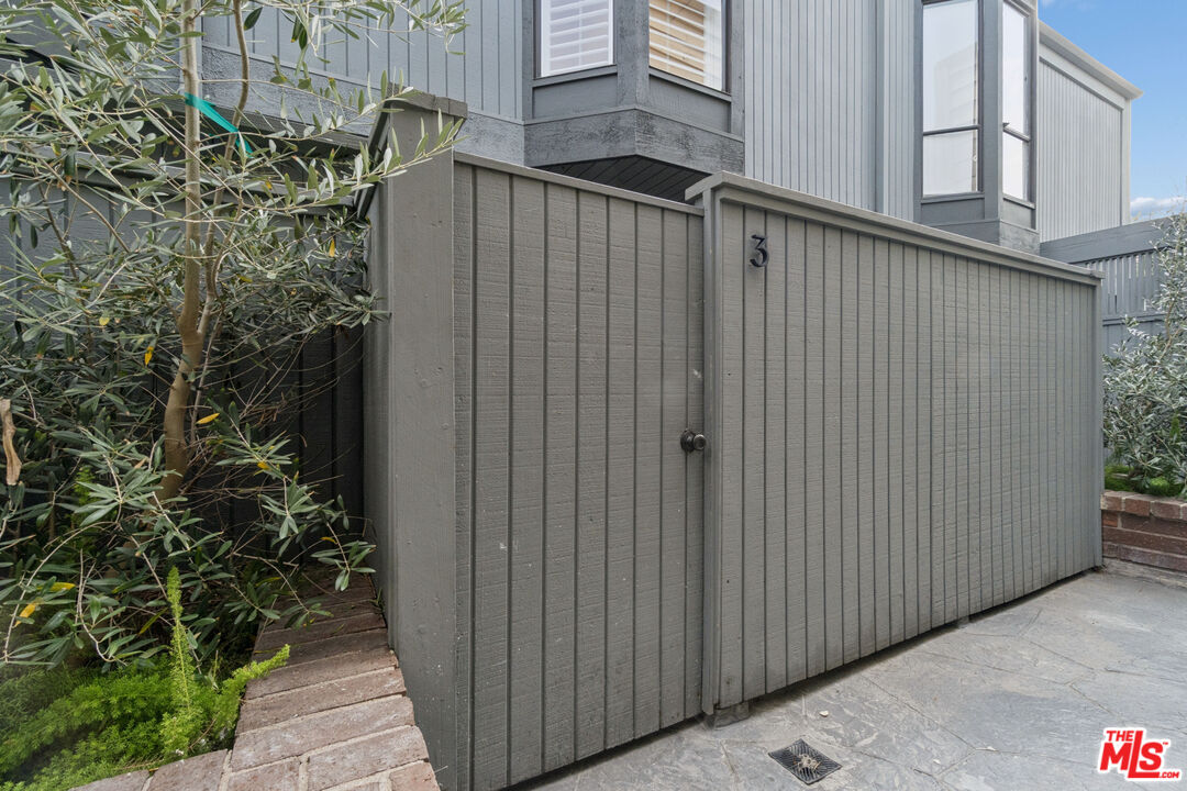 880 Hilldale Avenue, Unit 3 West Hollywood, CA 90069 - Photo 36 of 43 a view of a wooden door with a tree