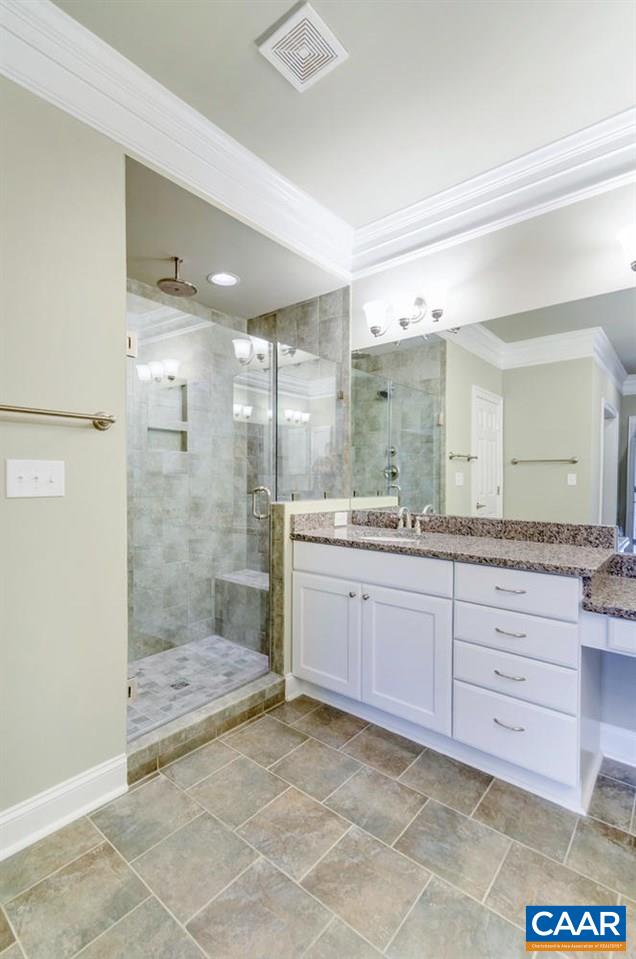 2635 South Bennington Road Charlottesville, VA 22901 - Photo 16 of 28 a bathroom with a granite countertop sink mirror and shower