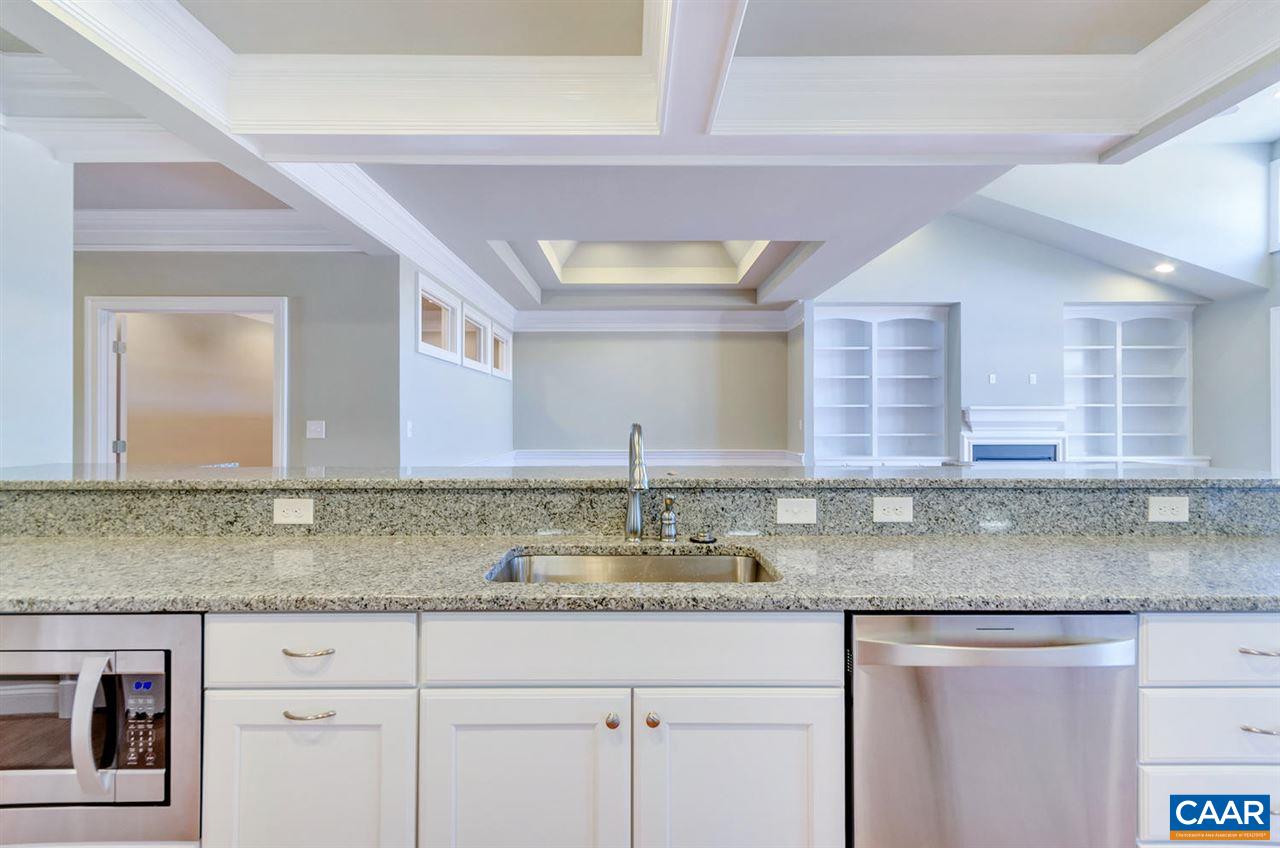 2635 South Bennington Road Charlottesville, VA 22901 - Photo 5 of 28 a kitchen with granite countertop a sink and cabinets