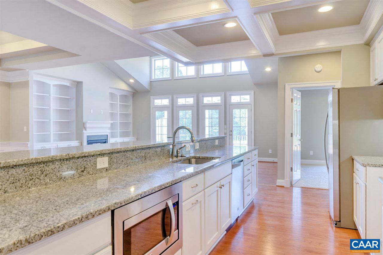 2635 South Bennington Road Charlottesville, VA 22901 - Photo 6 of 28 a kitchen with granite countertop a sink and a wooden floor