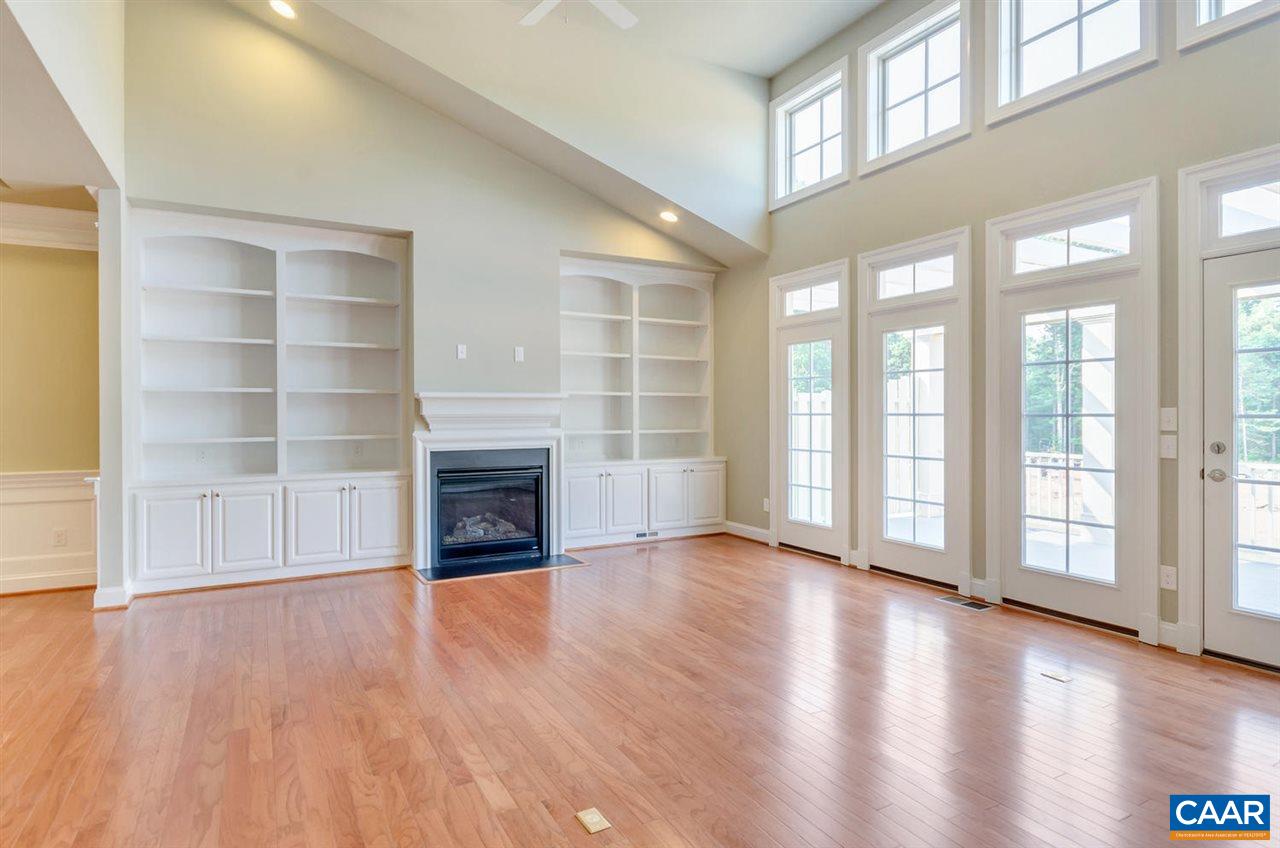 2635 South Bennington Road Charlottesville, VA 22901 - Photo 8 of 28 wooden floor fireplace and windows in an empty room