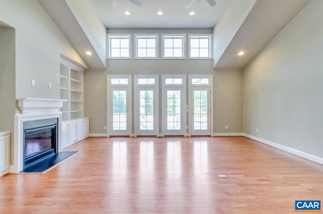2635 South Bennington Road Charlottesville, VA 22901 - Photo 9 of 28 a view of an empty room with wooden floor and a window