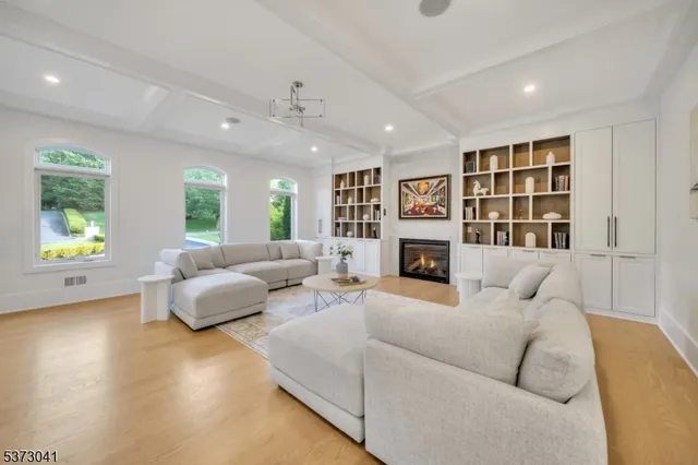 a lobby with furniture and a chandelier