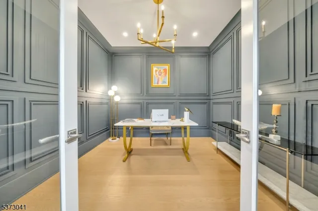 a bathroom with a granite countertop sink a toilet and mirror