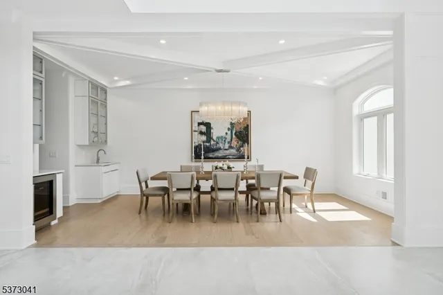 a bedroom with a large bed and potted plant