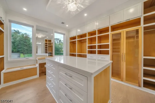a view of walk in closet and window