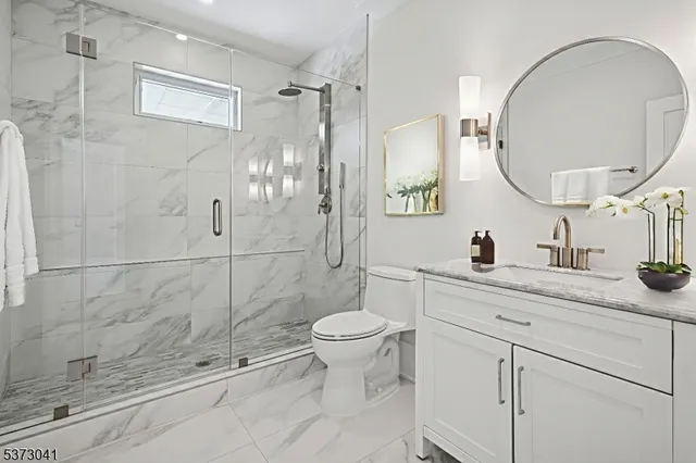 a bedroom with a bed and a flat tv screen