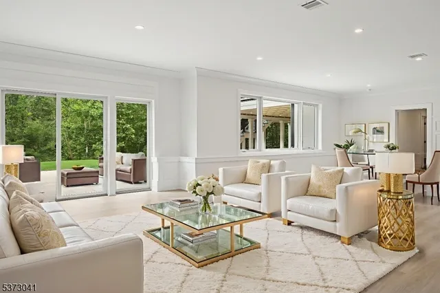 a bed room with furniture and a flat screen tv