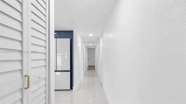 a view of an empty room and wooden floor