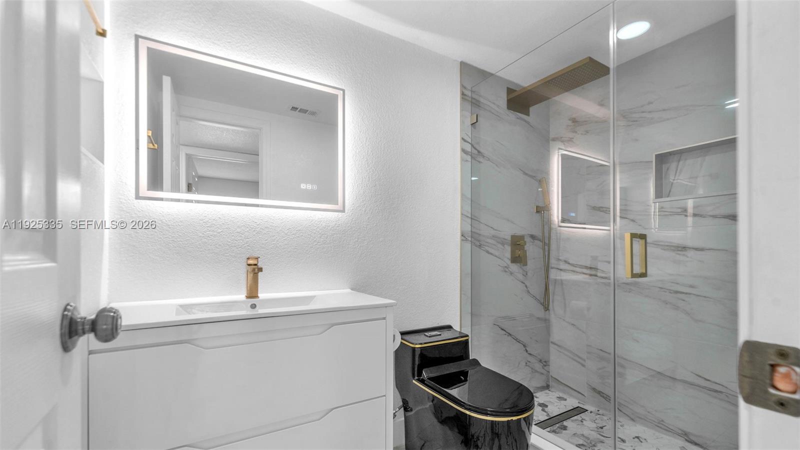 11421 Southwest 84th Street, Unit 1 Miami, FL 33173 - Photo 24 of 44 a bathroom with a toilet and a sink