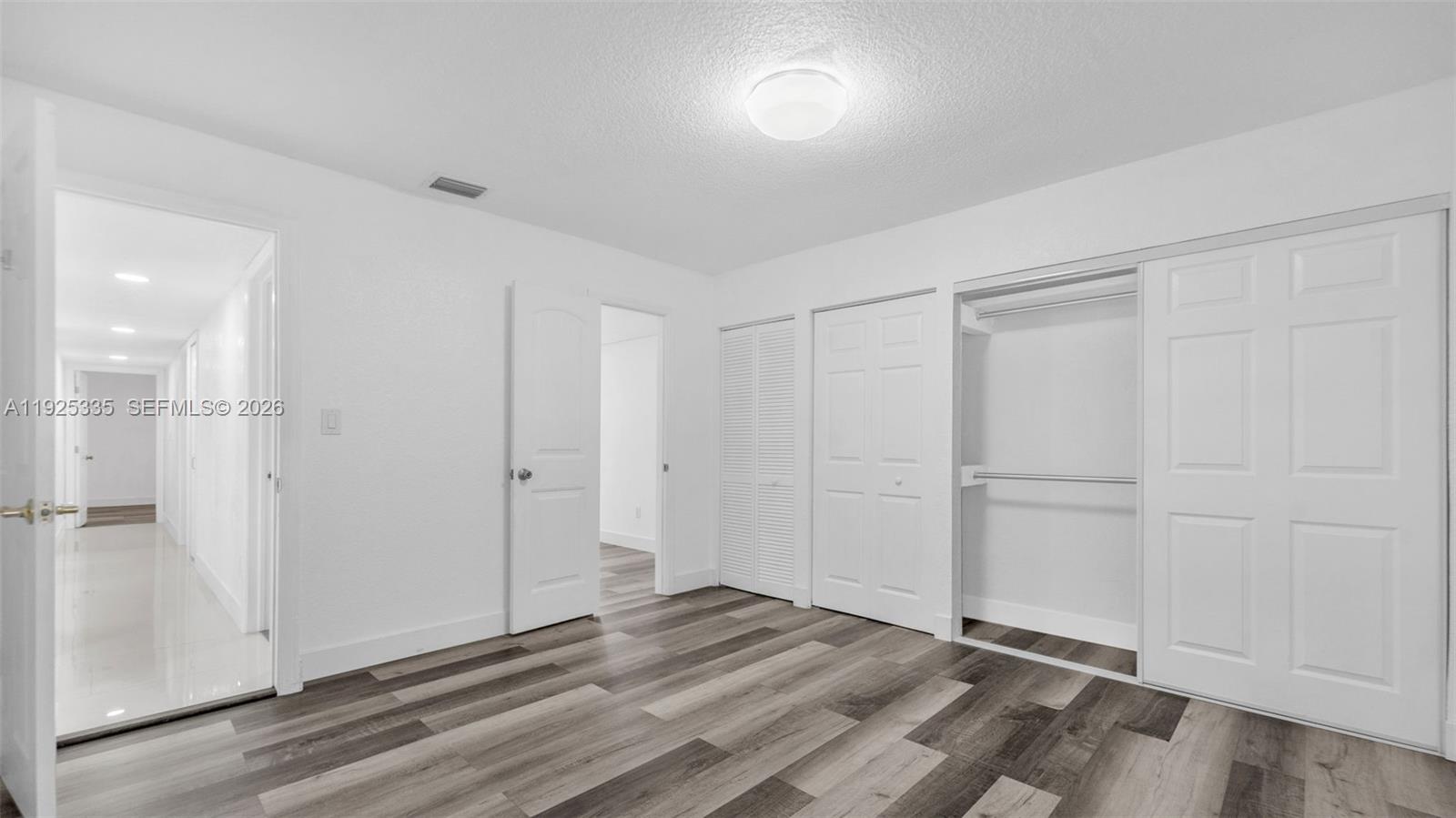 11421 Southwest 84th Street, Unit 1 Miami, FL 33173 - Photo 25 of 44 a view of an empty room