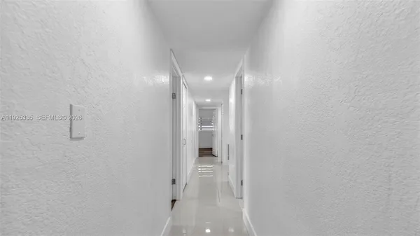 a view of storage and utility room with wooden floor