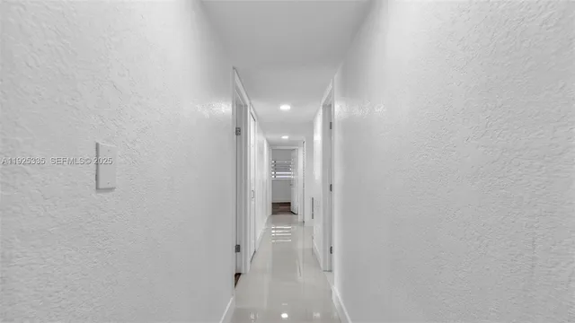 a view of storage and utility room with wooden floor