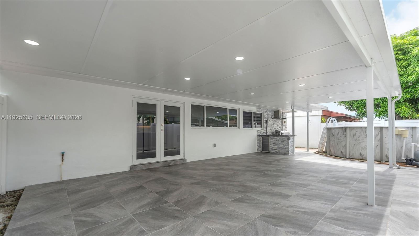 11421 Southwest 84th Street, Unit 1 Miami, FL 33173 - Photo 36 of 44 a view of a porch