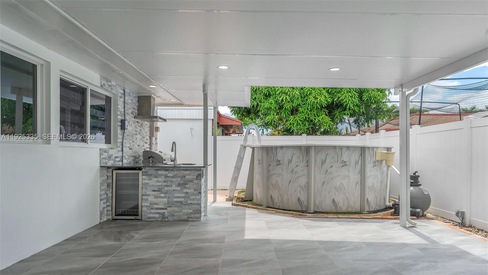 11421 Southwest 84th Street, Unit 1 Miami, FL 33173 - Photo 38 of 44 a view of outdoor space and yard