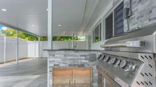 a view of a patio with a table and chairs