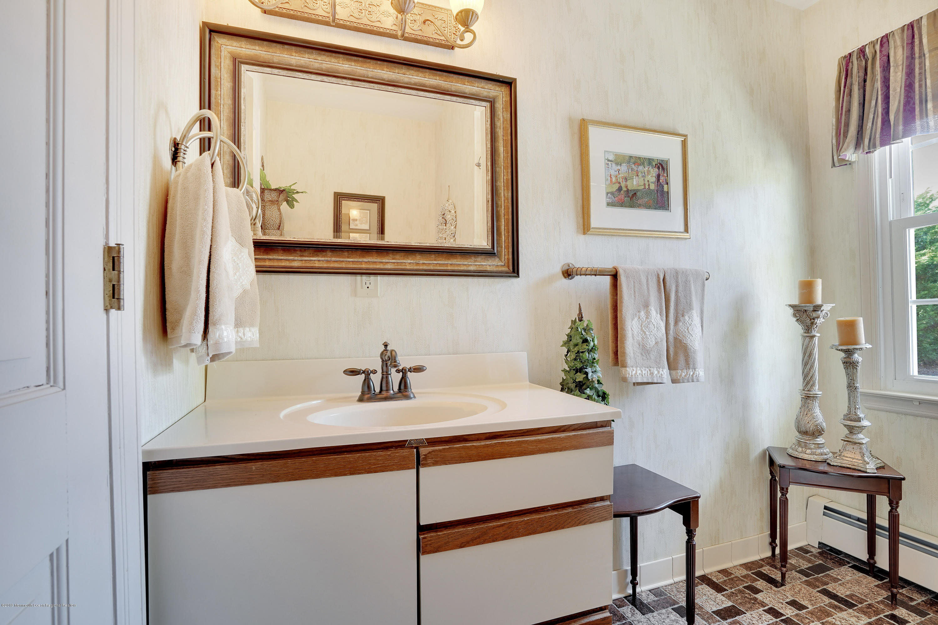33 Hulse Landing Road Brick, NJ 08723 - Photo 17 of 42 a bathroom with a sink vanity and a mirror