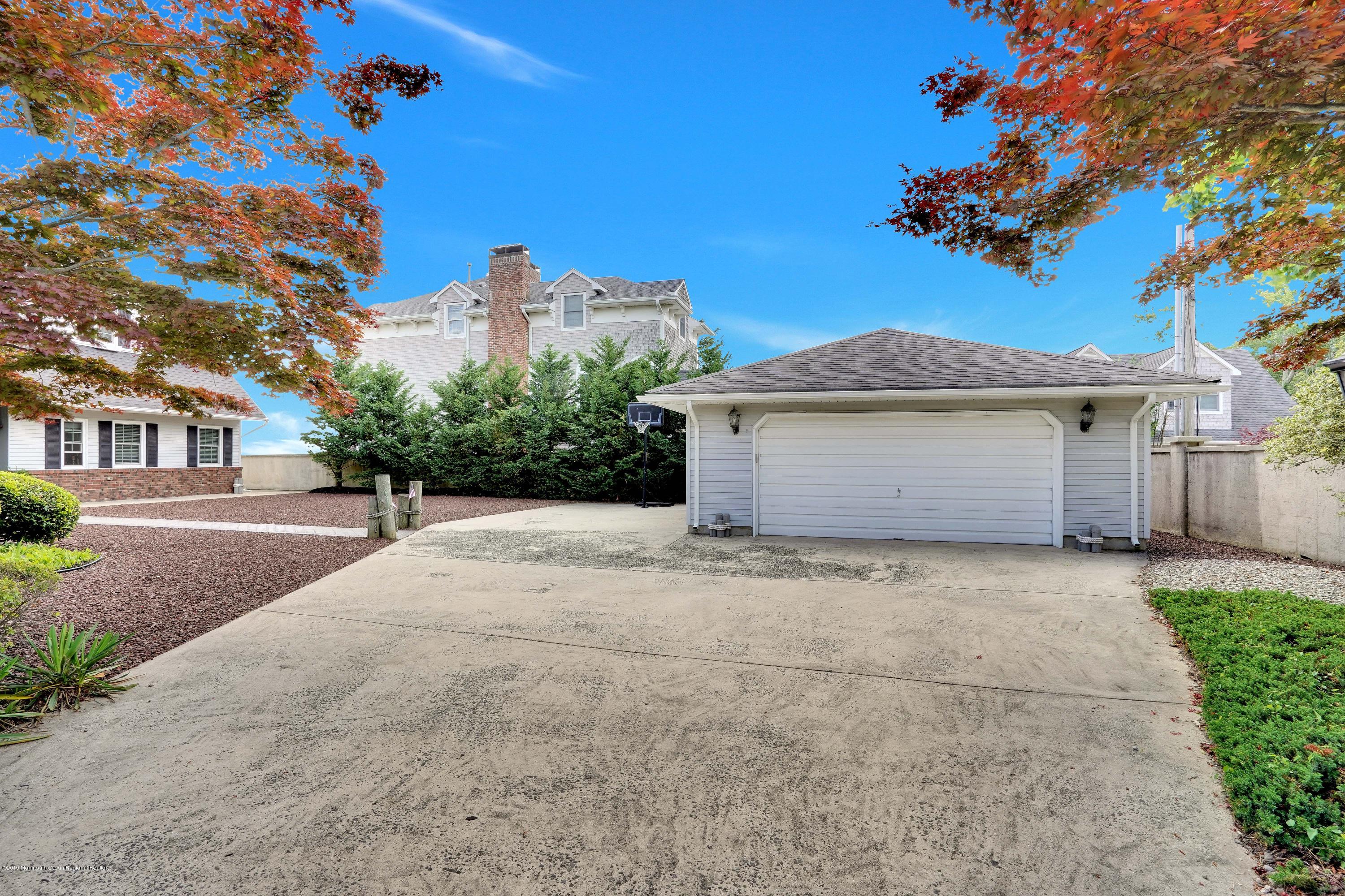 33 Hulse Landing Road Brick, NJ 08723 - Photo 41 of 42 a front view of a house with a yard and garage