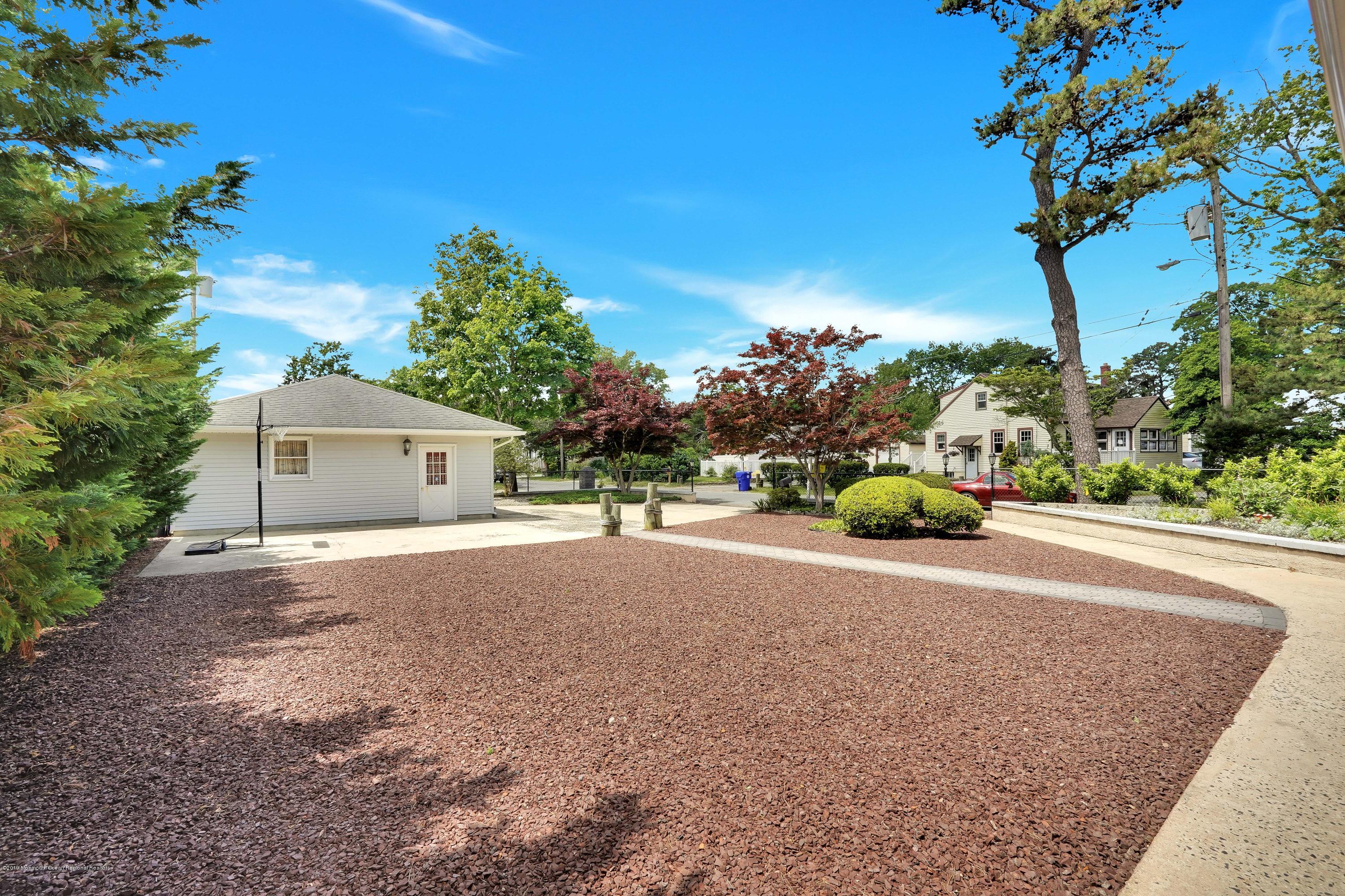 33 Hulse Landing Road Brick, NJ 08723 - Photo 42 of 42 a front view of a house with a yard and a garage