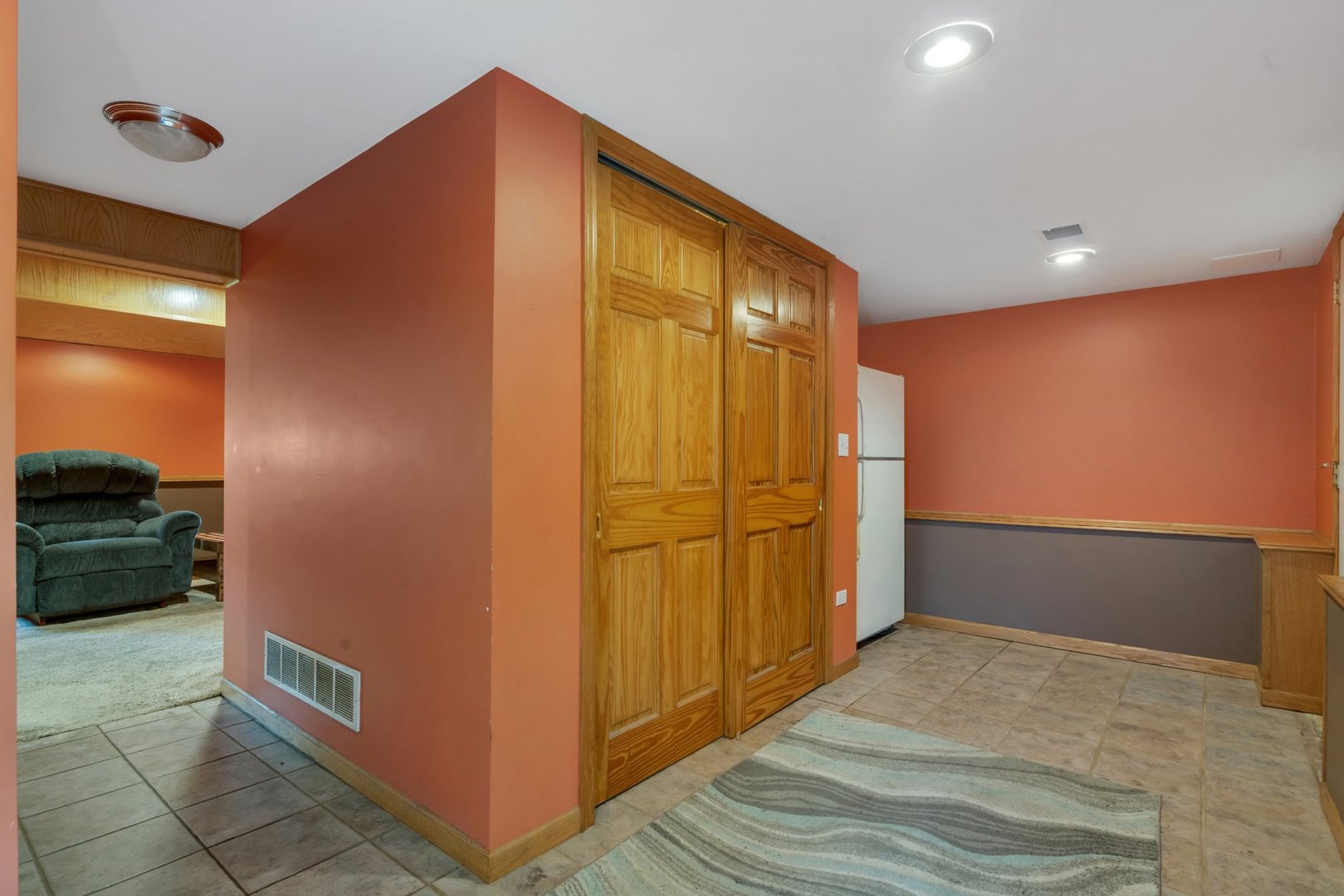 13130 McKanna Road Minooka, IL 60447 - Photo 23 of 56 a view of a hallway with stainless steel appliances wooden floor and cabinet