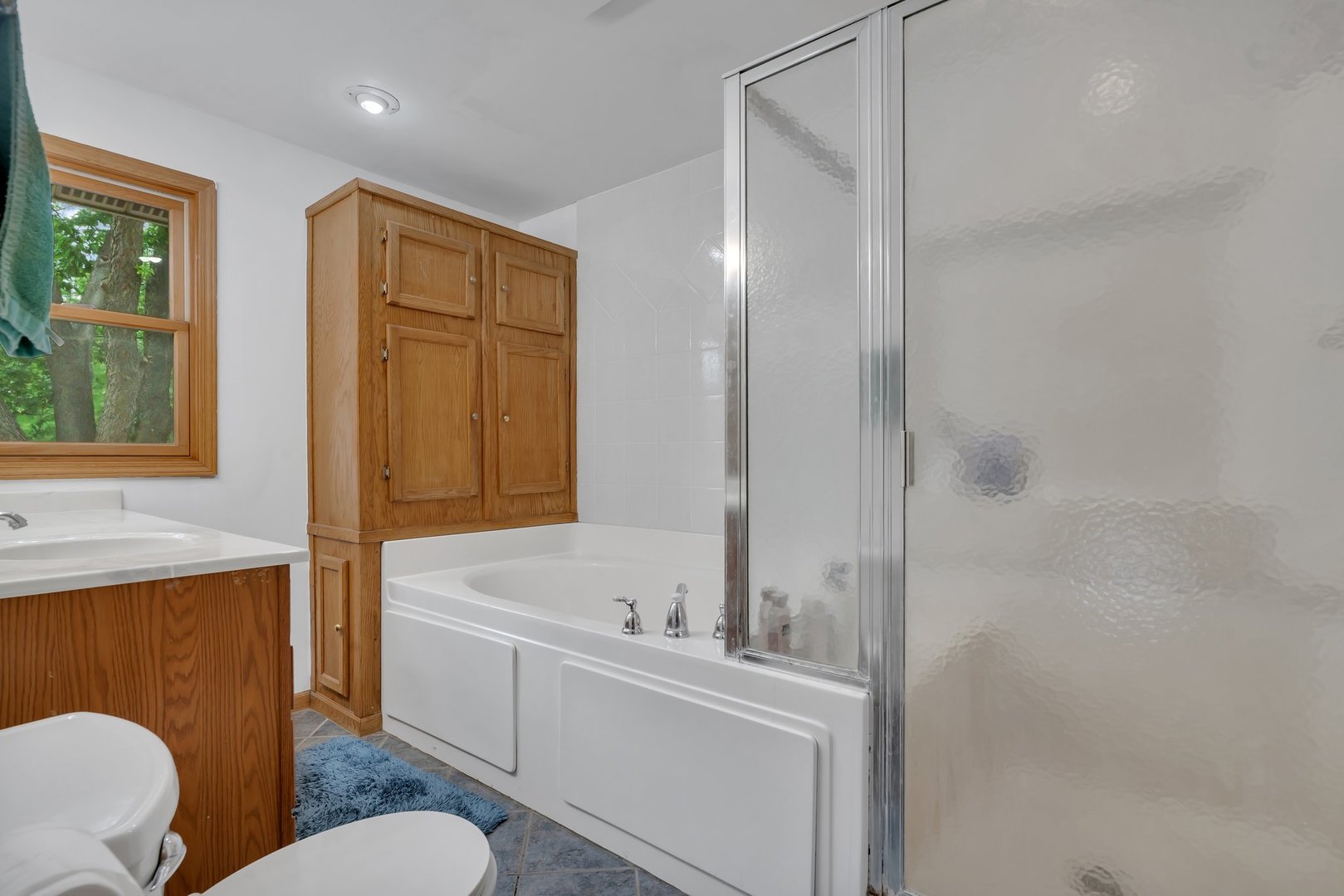 13130 McKanna Road Minooka, IL 60447 - Photo 30 of 56 a bathroom with a sink a toilet a mirror and shower