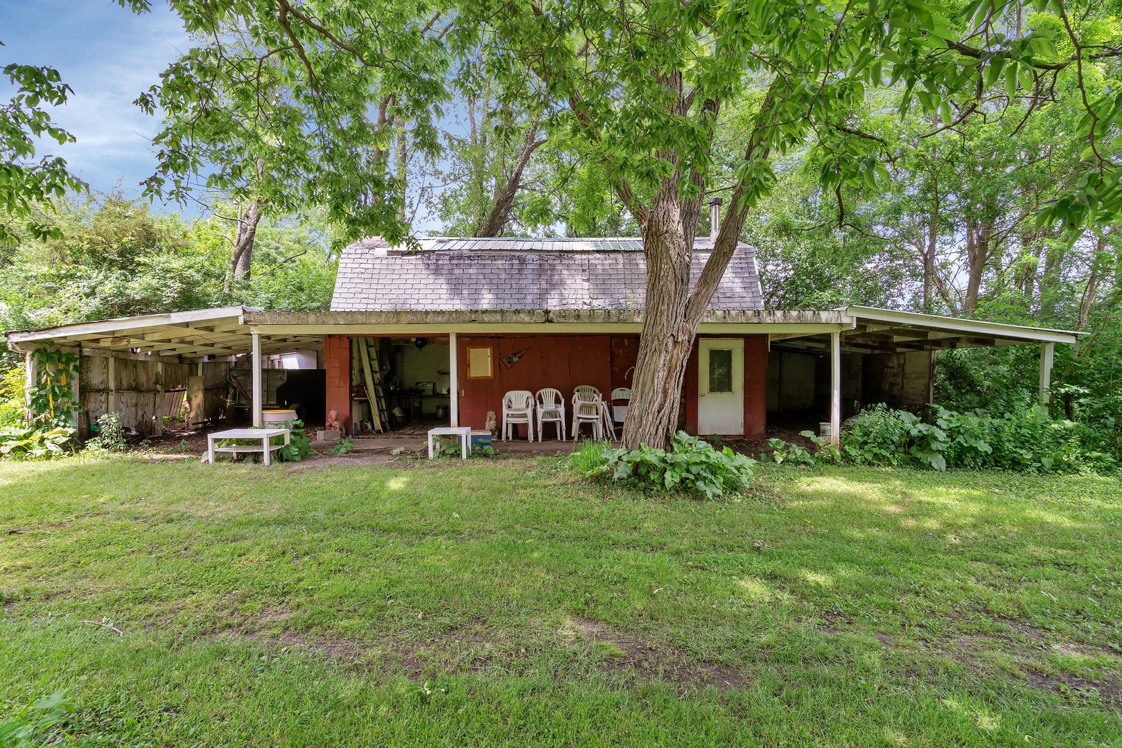 13130 McKanna Road Minooka, IL 60447 - Photo 43 of 56 a front view of a house with a yard table and chairs