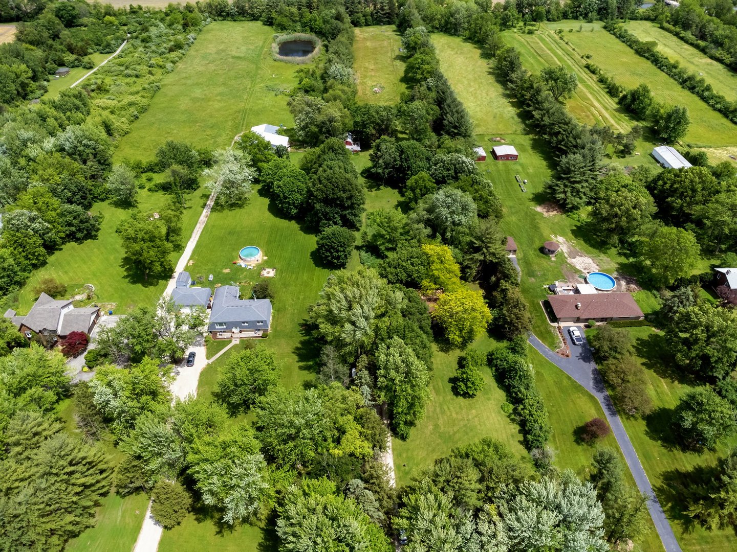13130 McKanna Road Minooka, IL 60447 - Photo 5 of 56 an aerial view of residential houses with outdoor space and trees all around