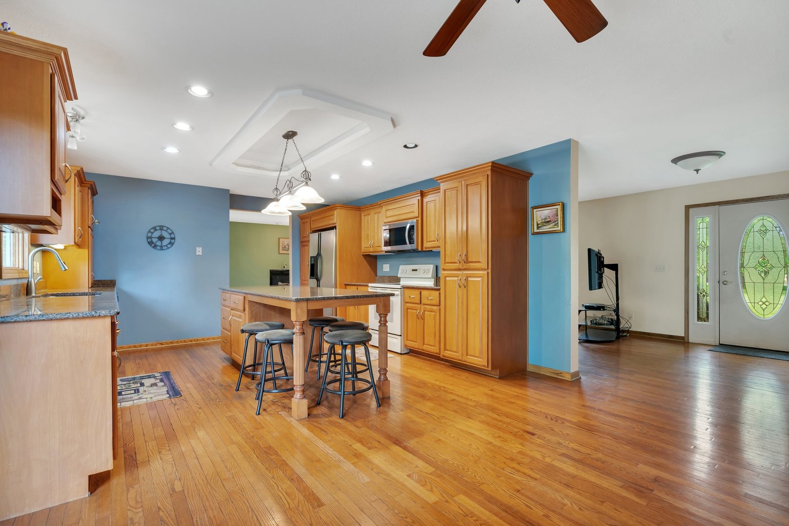 13130 McKanna Road Minooka, IL 60447 - Photo 8 of 56 a view of a dining room with furniture and wooden floor